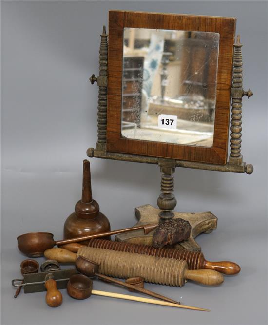 A group of treen and other kitchenalia including two oat rollers, a funnel and five assorted ladles